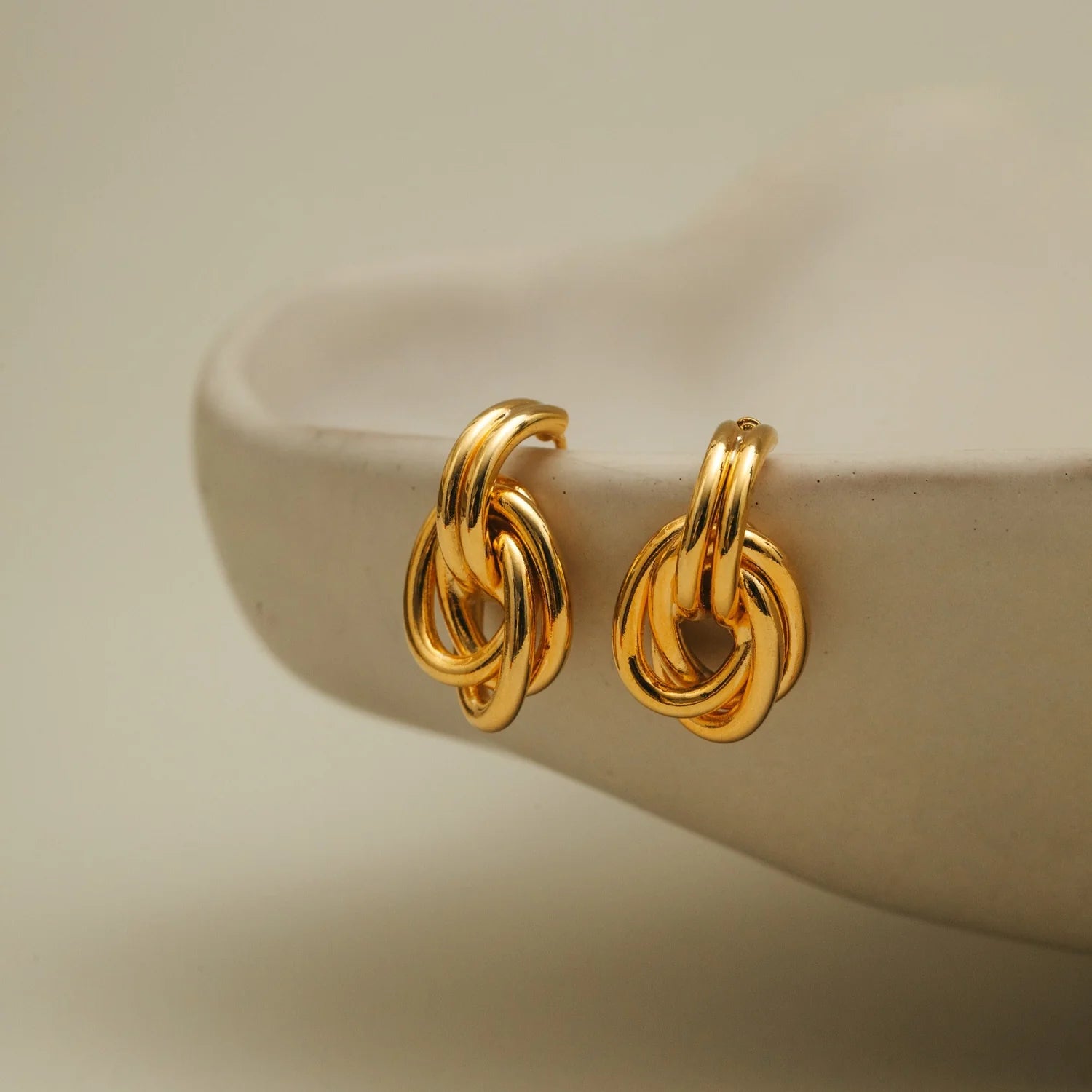 Orelia Interlocking Oval Gold Drop Earrings